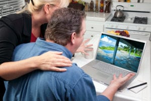 Man and woman looking at computer screen