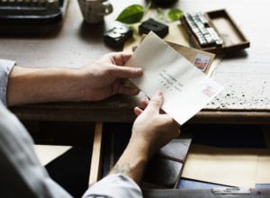 businessman holding letters