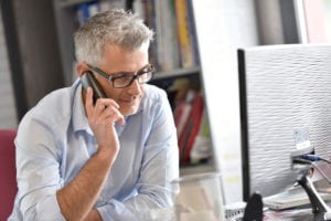 man talking on phone in office