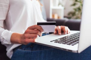 woman making payment on laptop